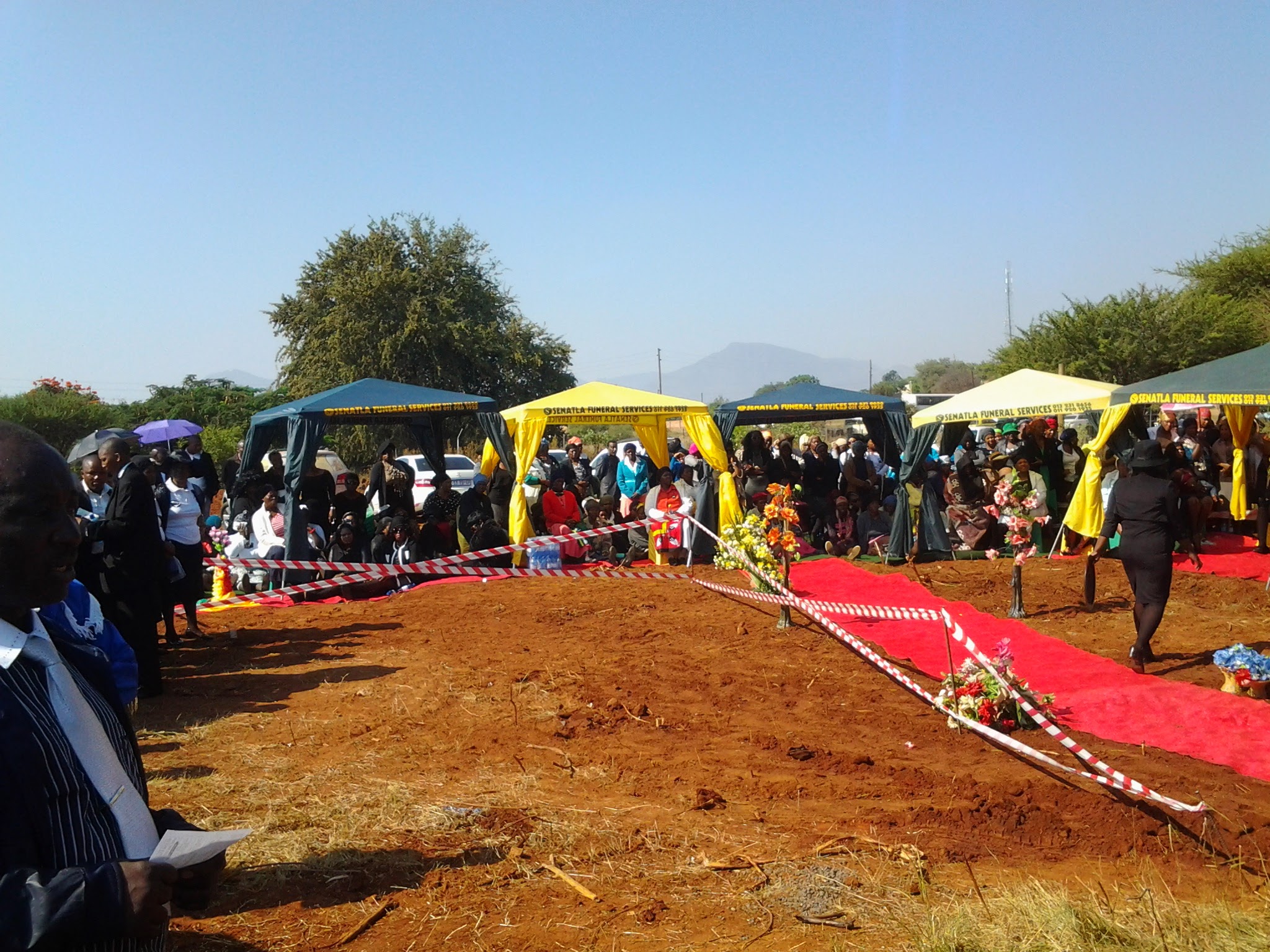 Family and mourners gathered at a Senatla funeral service